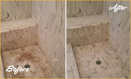 Before and After Picture of a Dirty Silver Lake Marble Shower Cleaned to Eliminate Dark Stains